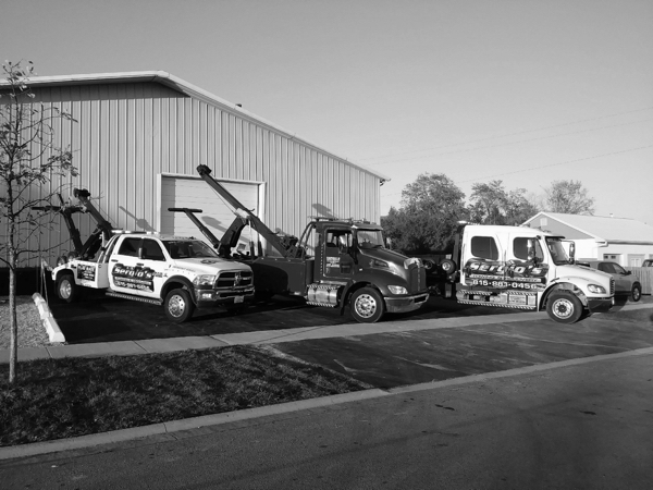 one of out tow truck park in out lot in lockport, il