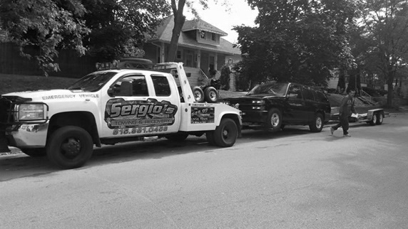 One of our drivers towing a car in joliet